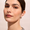 Reversible Sparkle Link Hoop Earrings in White on model