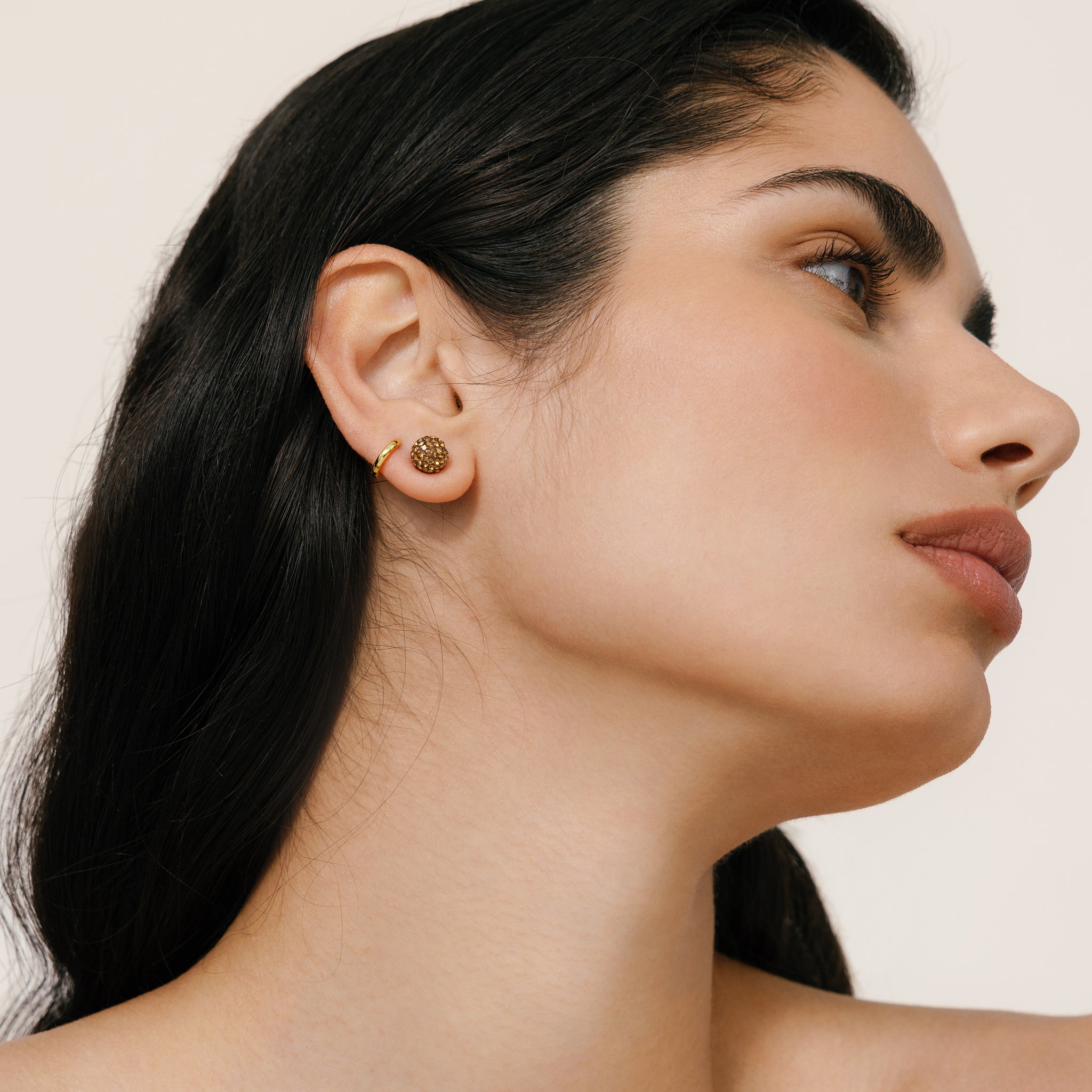 Small Espresso Sparkle Ball™ Stud Earrings on model