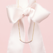 Ballet Slipper Curved Bar Necklace hanging with bow