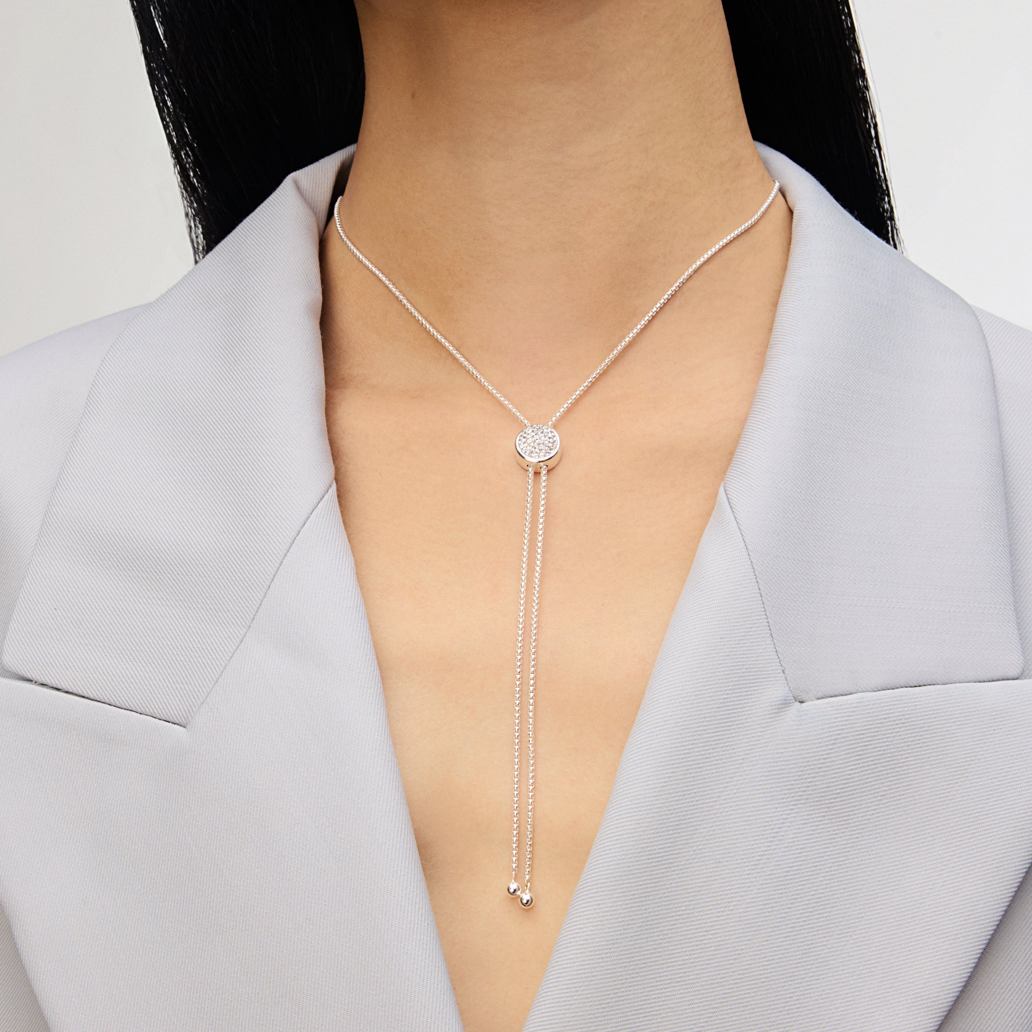 White Sparkle Bezel Bolo Tie Necklace on model