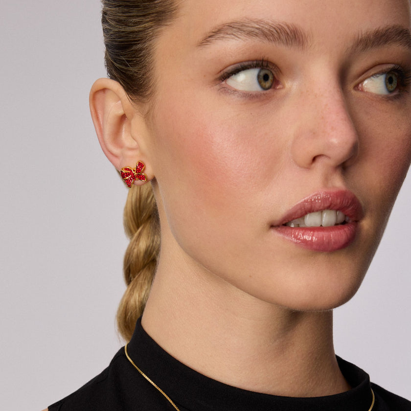 Red Velvet Sparkle Bow Stud Earrings on model