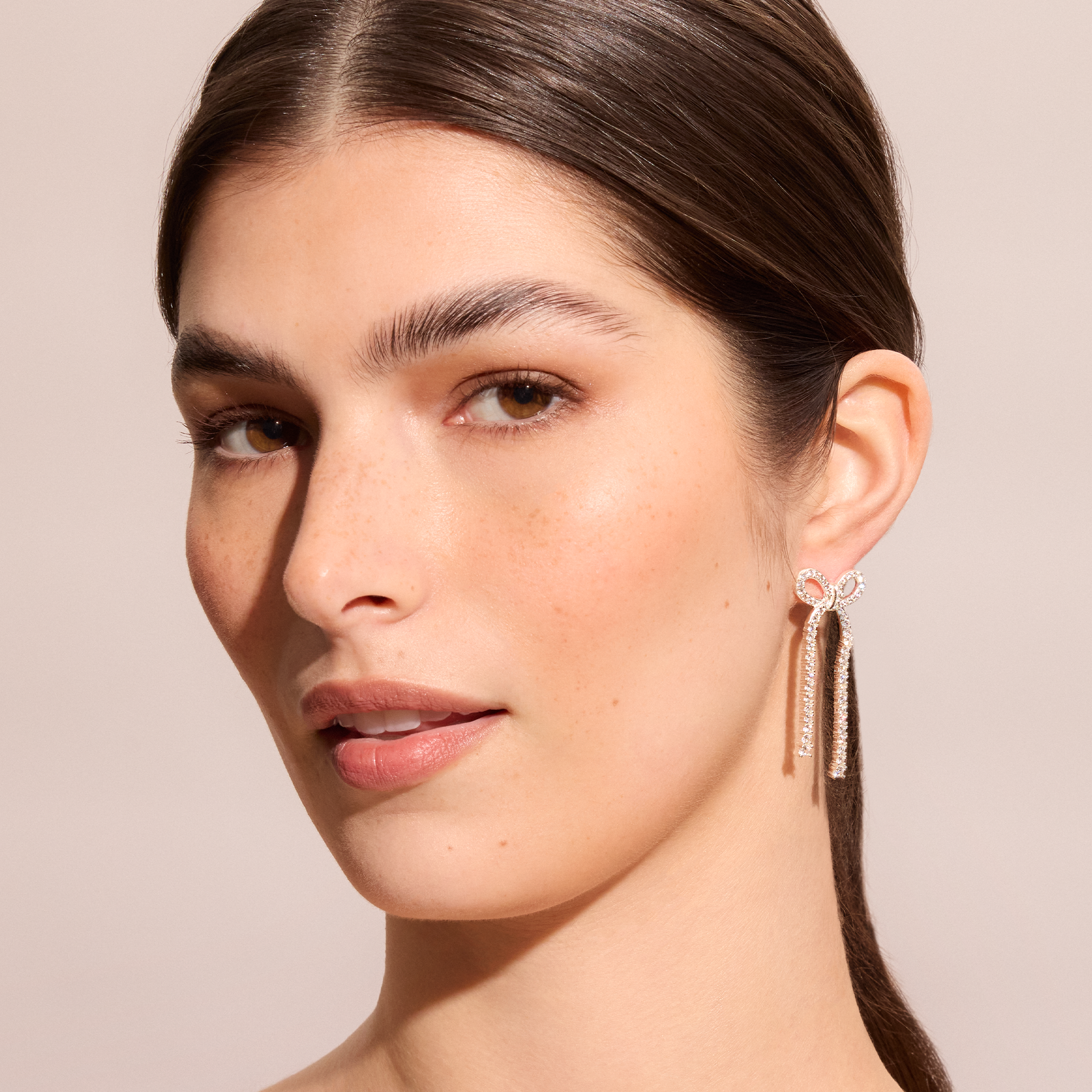 Tennis Bow Statement Earrings on model