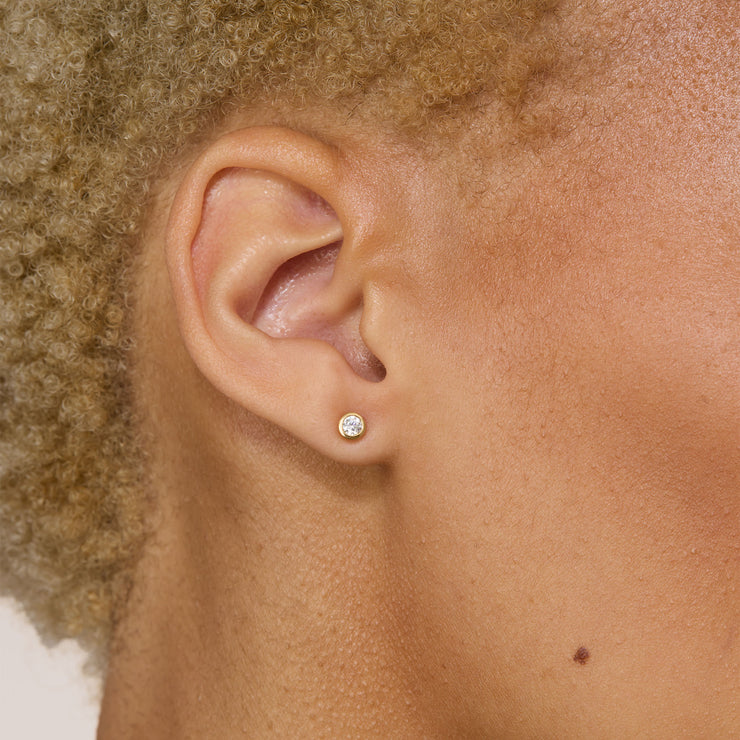 Triplet Stud Earrings Gold 4mm on model