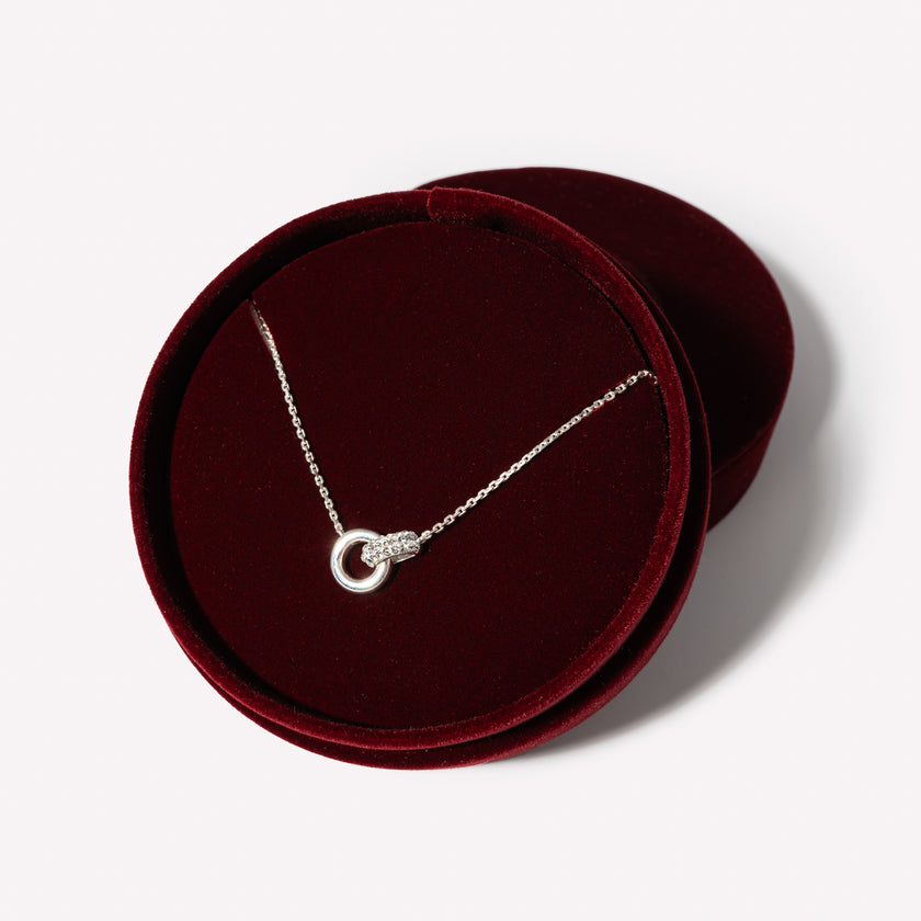 White Interlock Sparkle Necklace in packaging