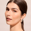 White Pearl Hoop Earrings on model