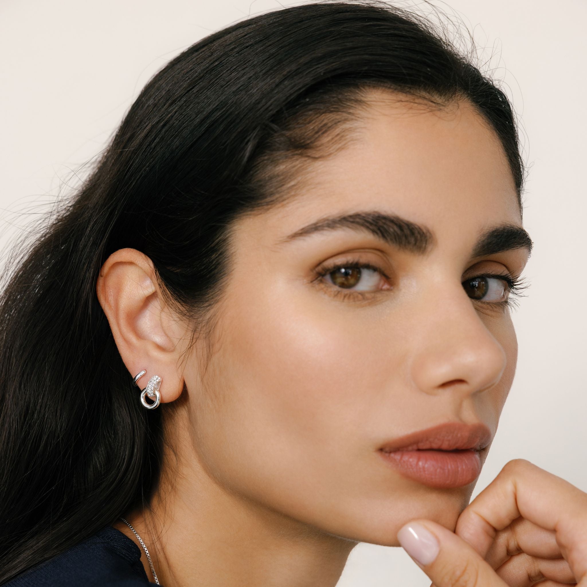 White Soft Gold Interlock Sparkle Earrings on model