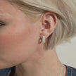Small Sparkle Hoop Earrings in White on model video