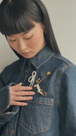 Sparkle Lizard Brooch, Safety Pin Brooch, and Pearl Brooch on model