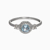 Round Sky Blue Topaz and Diamond Halo Ring in 14K White Gold