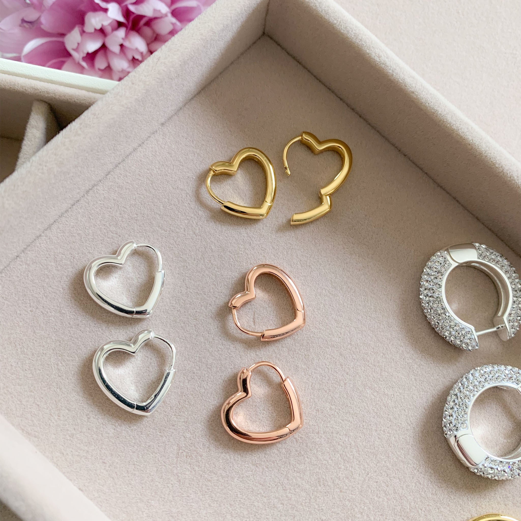 Heart Huggie Hoop Earrings in a case