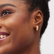 Reversible Bold Hoop Earrings Gold Side on model